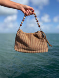 WOVEN BAG WITH BALL HANDLE